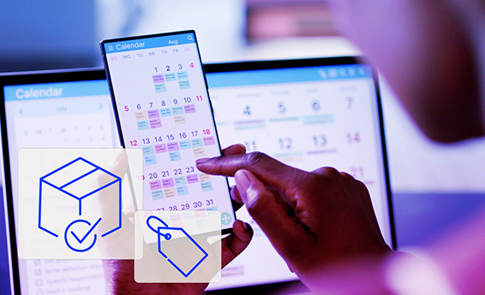 A business owner sits with their phone showing a calendar with key sales dates highlighted.